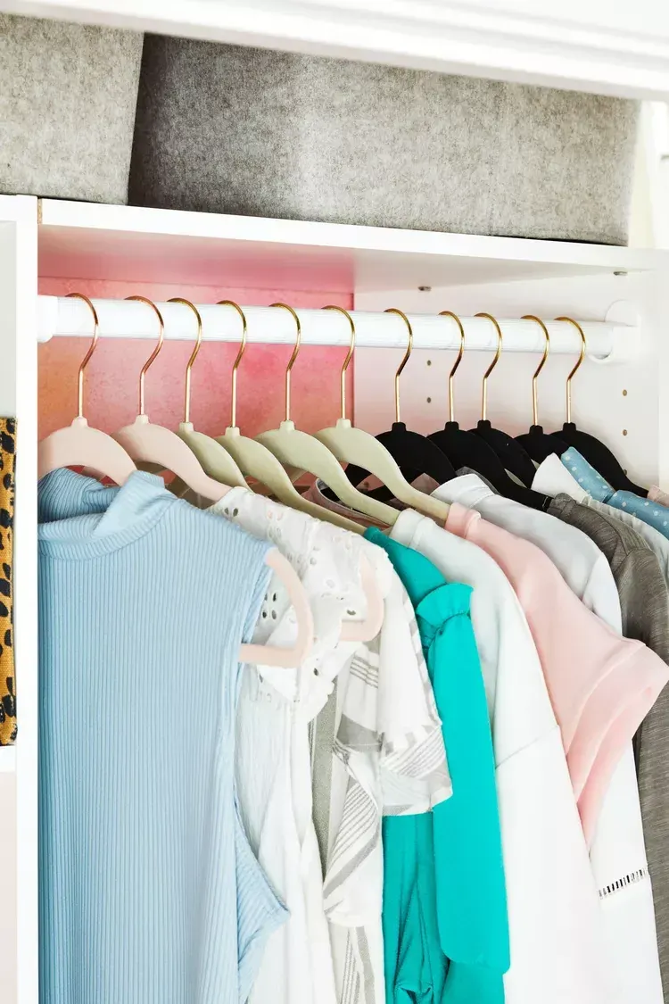Wardrobe with various hanging clothes suggesting items ready for donation in Dubai