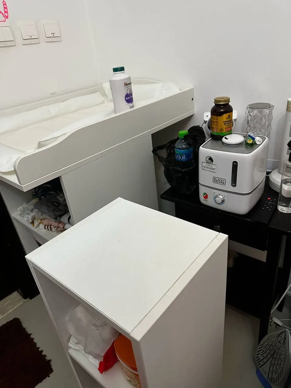 Small room with countertop appliances and cleaning supplies suggesting checks before reusing appliances at home