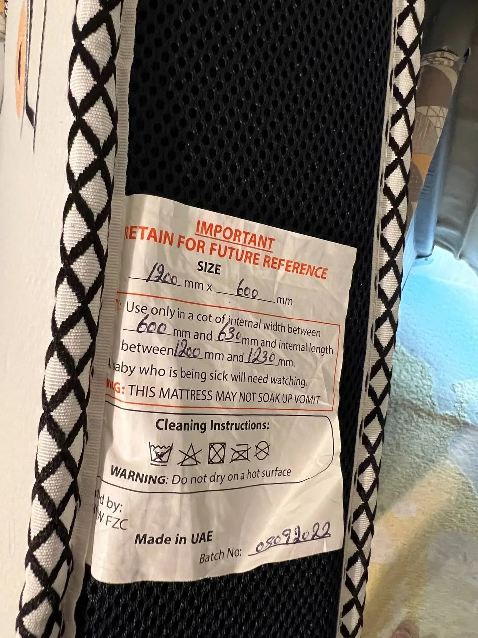 Document-style photo with partially readable product care and safety text made in the UAE