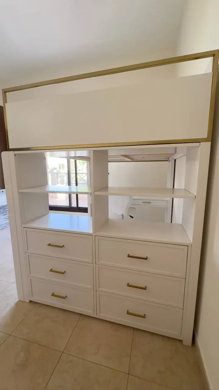 White dresser with drawers, open shelves, and a top cabinet for student room furniture reuse in the UAE